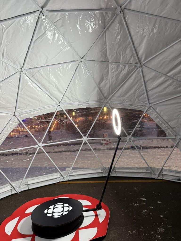 Interior of a geodesic dome featuring a 360 Video Booth platform with a circular light and branded logo, designed for immersive event experiences.
