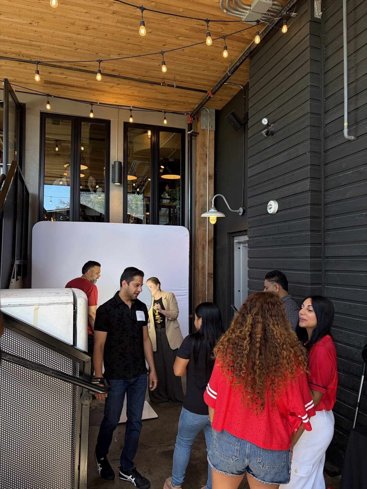 Cosmo Photo Booths activation at CRAFT Vancouver, guests posing for custom AI trading cards and branded experience.