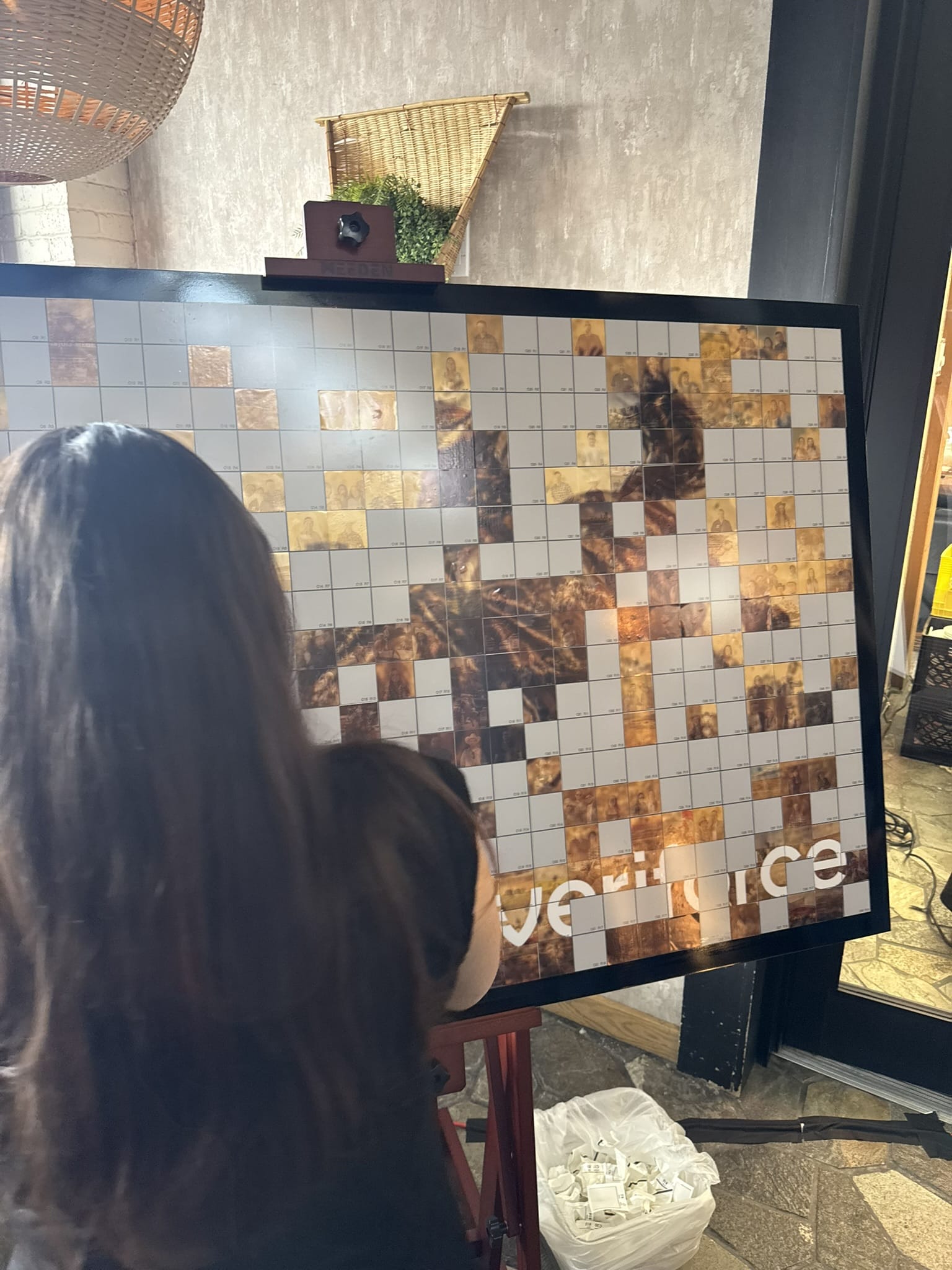Mosaic artwork in progress featuring Veriforce logo, guest photo tiles, and Cosmo Photo Booths experience.